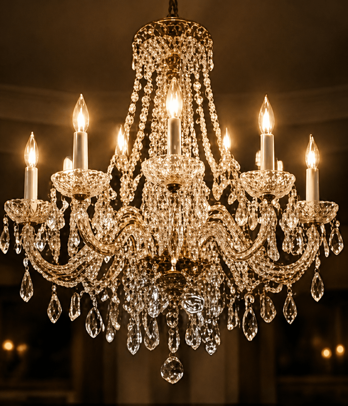 Crystal chandelier lit in an elegant room
